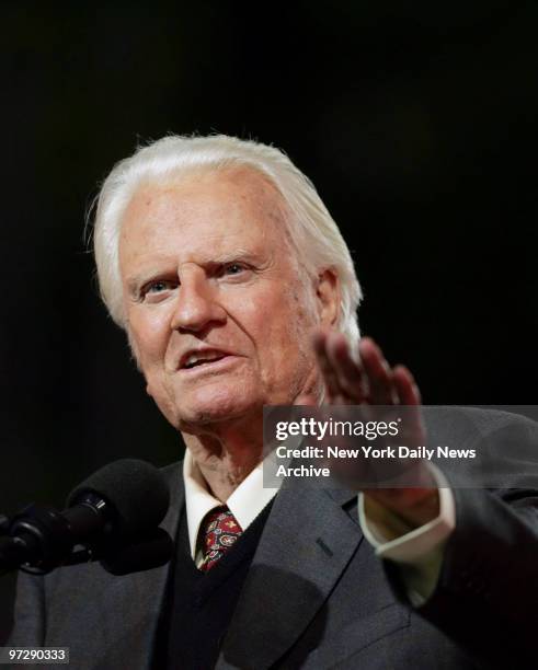 The Rev. Billy Graham preaches to the crowd on the first night of the Greater New York Billy Graham Crusade at Flushing Meadows-Corona Park in...