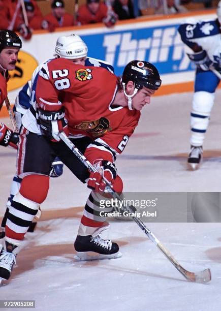 Steve Larmer of the Chicago Black Hawks skates against the Toronto Maple Leafs during NHL game action on December 23, 1989 at Maple Leaf Gardens in...