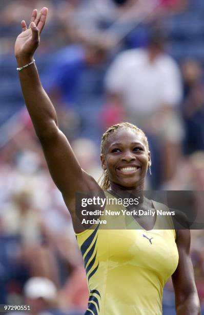 Serena Williams waves to crowd after defeating Martina Sucha of Slovakia, 6-1, 6-0, at the U.S. Open tennis tournament in Flushing Meadows - Corona...
