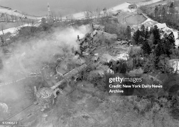 Mansion Destroyed by Fire. Thick smoke rises from the roof of burning 85-room mansion in Laurel Hollow as firemen battle to control the blaze. The...