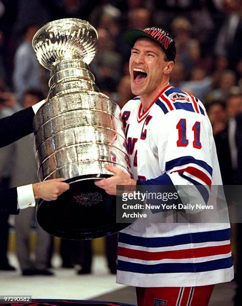 Captain Mark Messier receives the Stanley Cup after the Rangers defeated the Vancouver Canucks 3-2 in game 7 of the Stanley Cup finals at the Garden.