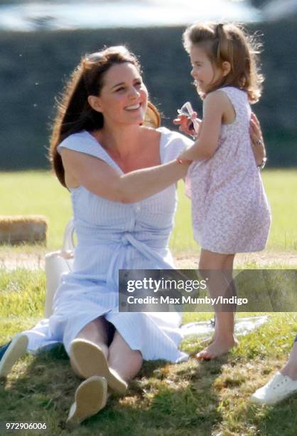 Catherine, Duchess of Cambridge and Princess Charlotte of Cambridge attend the Maserati Royal Charity Polo Trophy at the Beaufort Polo Club on June...