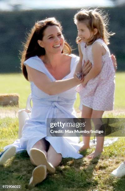 Catherine, Duchess of Cambridge and Princess Charlotte of Cambridge attend the Maserati Royal Charity Polo Trophy at the Beaufort Polo Club on June...