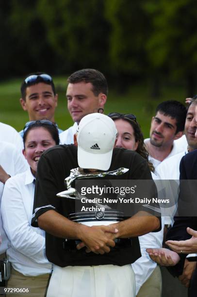 Sergio Garcia kisses his trophy after besting Padraig Harrington and Rory Sabbatini in a three-way playoff during the final round of the Buick...