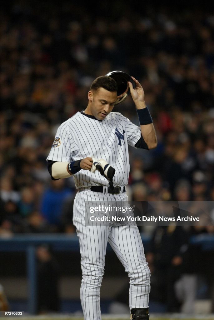 New York Yankees' Derek Jeter reacts after he struck out swi