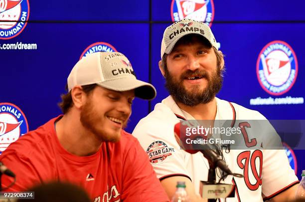 John Carlson and Alex Ovechkin of the Washington Capitals talk with the media at Nationals Park on June 9, 2018 in Washington, DC.