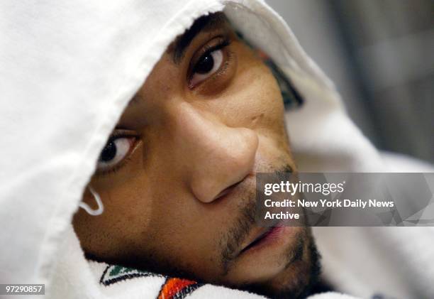 New Jersey Nets forward Kenyon Martin, feeling a bit off form, stays under wraps as he talks to reporters at Champion Center in East Rutherford, N.J....