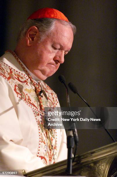 Cardinal Egan lowers his head in prayer during a memorial service at St. Patrick's Cathedral for victims of the terrorist attack on the World Trade...