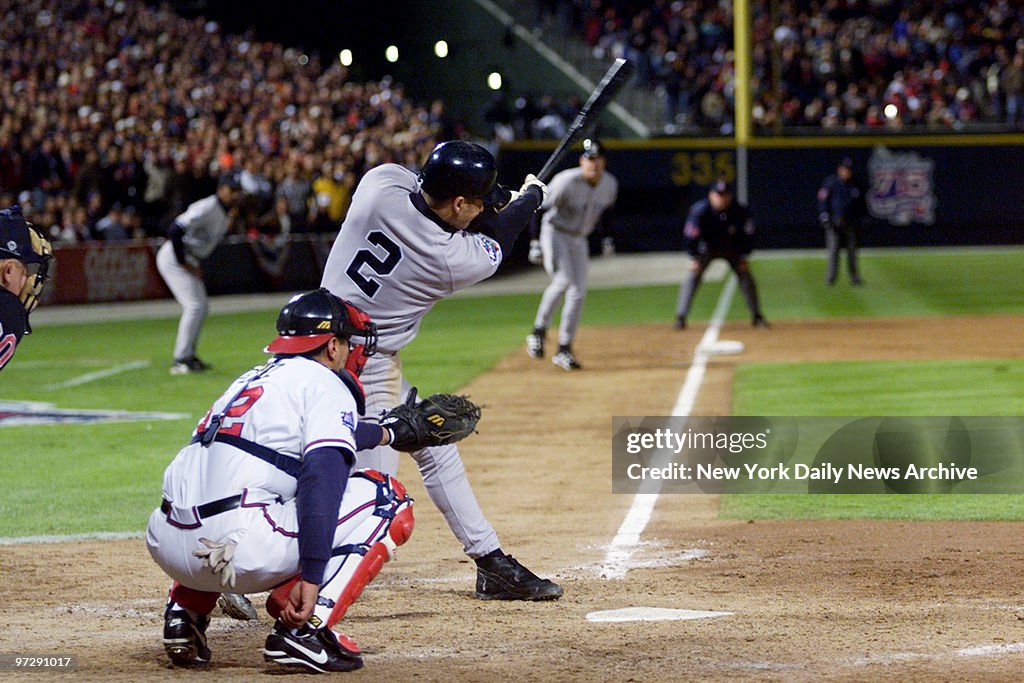 New York Yankees' Derek Jeter singles in the eighth inning t