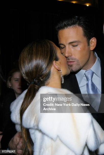 Jennifer Lopez and Ben Affleck steal a kiss as they arrive at the Ziegfeld Theater for the premiere of the movie "Maid in Manhattan." She stars in...