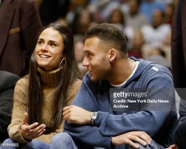 New York Yankees' Derek Jeter sits courtside with girlffriend Jordana Brewster as they watch the New Jersey Nets take on the Los Angeles Lakers at...