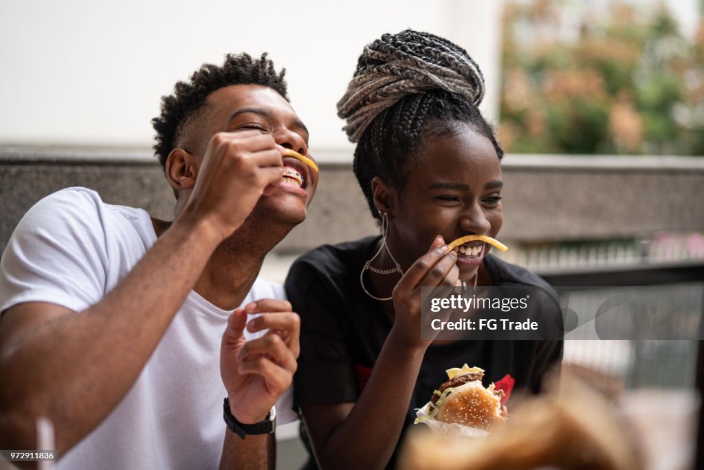 Group of young people having fun in a restaurant