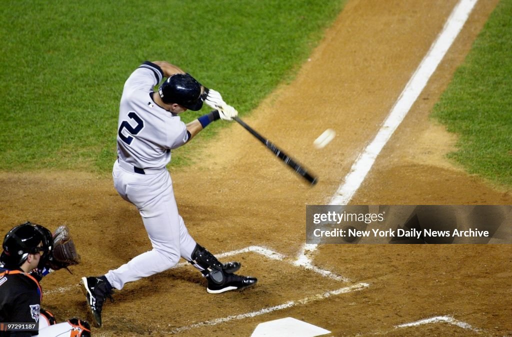 New York Yankees' Derek Jeter smacks the first pitch of the 