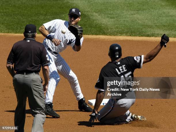 Carlos Lee of the Chicago White Sox is safe at second as New York Yankees' shortstop Derek Jeter waits for the throw in the first inning at Yankee...