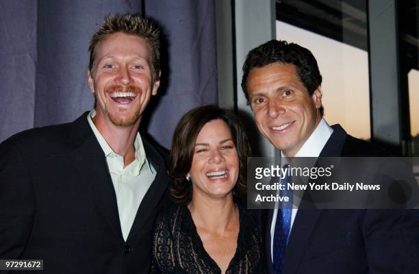 Marcia Gay Harden is flanked by her husband, writer Thaddaeus Scheel , and Andrew Cuomo at the People's Campaign Summer Gala, a fundraiser for...