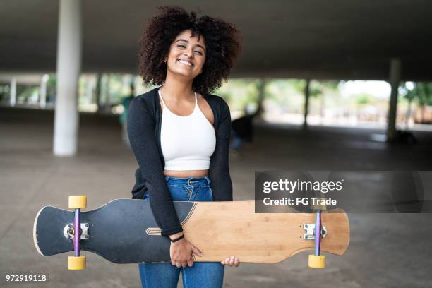 portrait of beautiful woman longboarding - ibirapuera park stock pictures, royalty-free photos & images