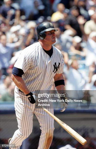 New York Yankees' Jason Giambi watches as the ball heads to the bleachers in right-center field for a two-run blast in the fourth inning against the...