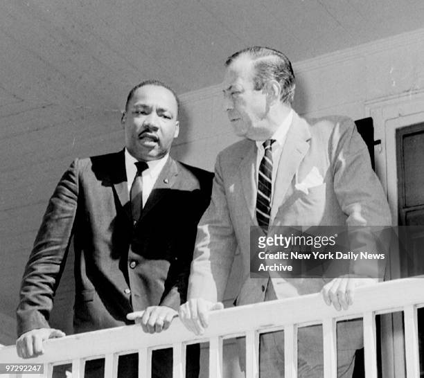The Rev. Martin Luther King and Mayor Wagner confer on porch at Gracie Mansion, ending three days of conferences on racial disturbances. Dr. King...