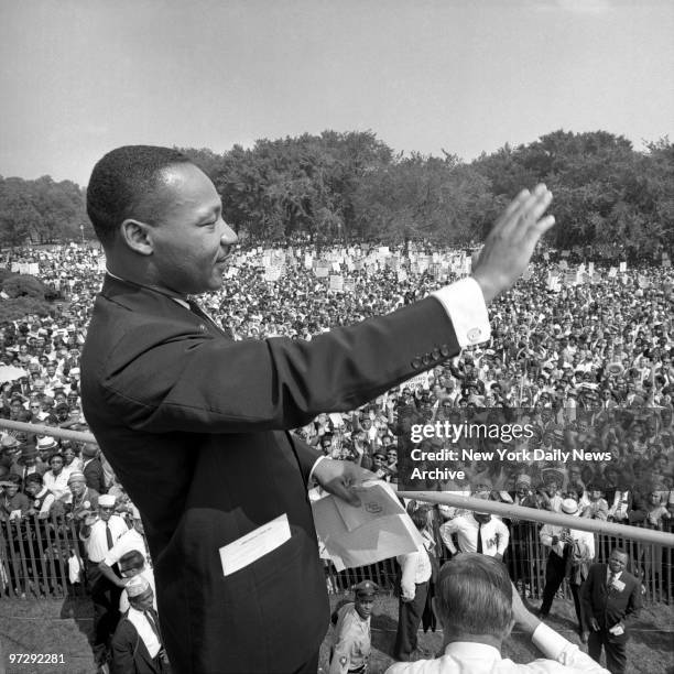 The Rev. Martin Luther King waves greeting to huge crowd at the Lincoln Memorial during Freedom Rally.