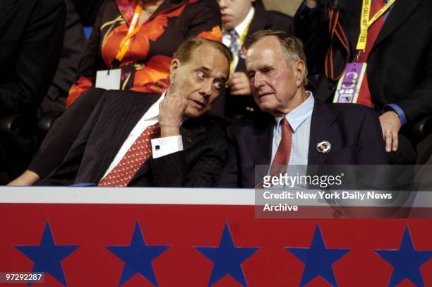 Former Sen. Bob Dole speaks with former President George Bush on the second day of the Republican National Convention at Madison Square Garden.