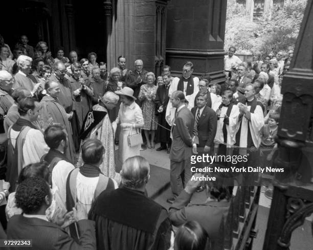 The Rev. Robert Parks, rector of Trinity Church, greets Queen Elizabeth II before paying back rent.