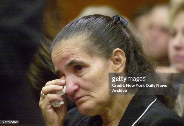 Maria Pe?a, mother and grandmother of victims, wipes away tears in Brooklyn Supreme Court where disgraced ex-cop Joseph Gray was given the maximum...