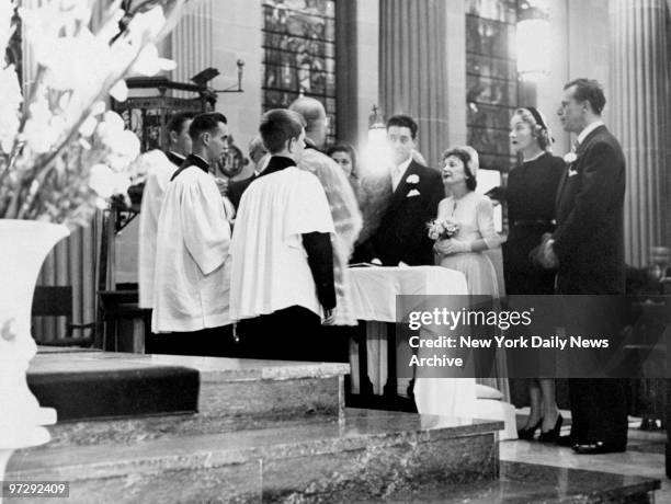 The Rev. Salvatore Piccirillo officiates at the marriage of Jacques Peals and Edith Piaf at St. Vincent de Paul Church on W. 23rd St.. Looking on are...