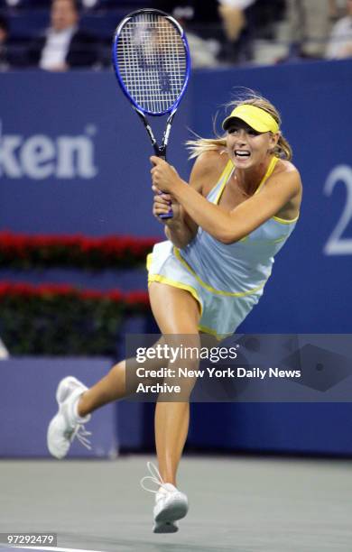 Maria Sharapova of Russia hits a shot to fellow Russian Nadia Petrova during quarterfinals in Arthur Ashe Stadium at the U.S. Open in Flushing...