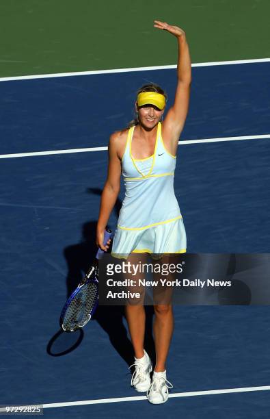 Maria Sharapova of Russia waves to the crowd after defeating Sania Mirza of India in a fourth-round match at Arthur Ashe Stadium during the U.S. Open...