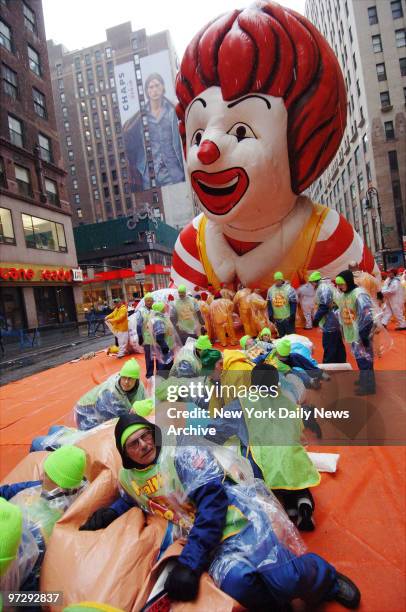 The Ronald McDonald balloon is ready for deflation at the end of the 80th annual Macy's Thanksgiving Day Parade. Despite gusty winds and intermittent...
