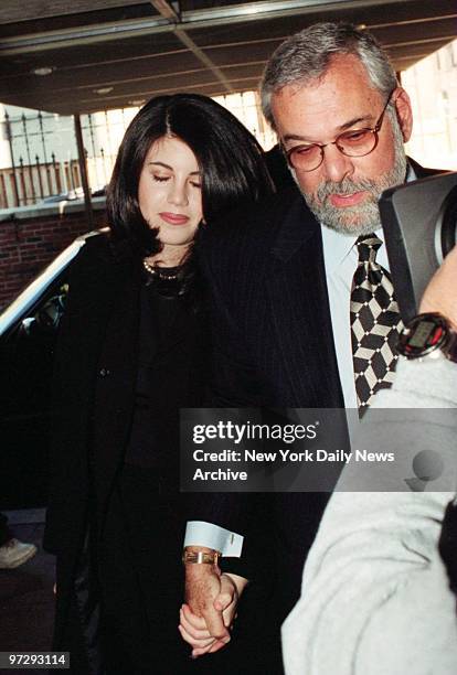 Former White House intern Monica Lewinsky and her lawyer William Ginsburg going to a Casino Club.