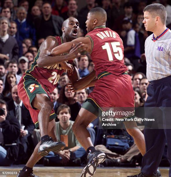 The Seattle Supersonics' Gary Payton charges angrily towards referee Ted Bernhardt after being called for a technical foul during first quarter of...