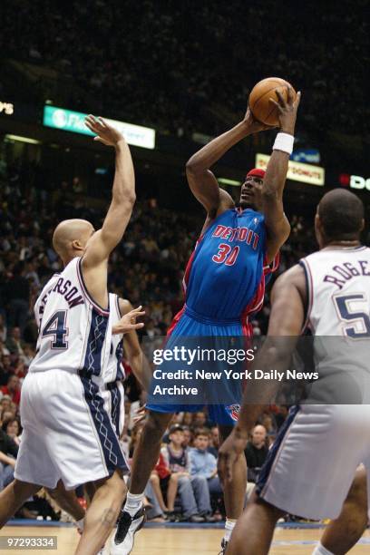 New Jersey Nets' Richard Jefferson and Rodney Rogers defend against Detroit Pistons' Clifford Robinson during first half of Game 4 of the Eastern...