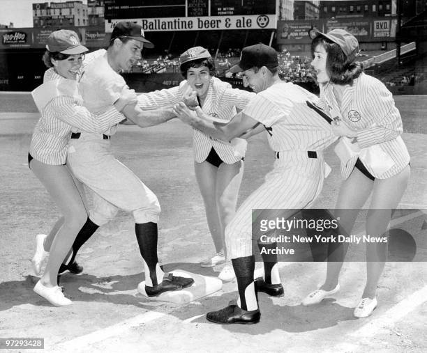 Jerry Coleman and Phil Rizzuto are "separated" by umpires Carolyn Larson, Elsie Lindauer and Holly Hill at Yankee Stadium.The umps intervened when...