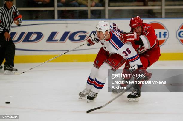 Carolina Hurrcanes' Niclas Wallin pursues New York Rangers' Matthew Barnaby during game action at Madison Square Garden. The Rangers went on to win,...