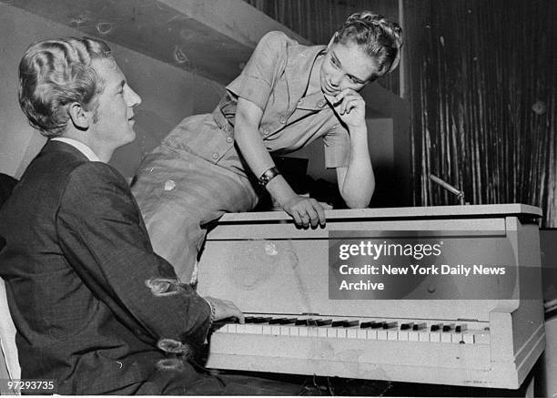 Jerry Lee Lewis and his 13-year-old bride, Myra, meet the press at the Vafe De Paree nightclub.