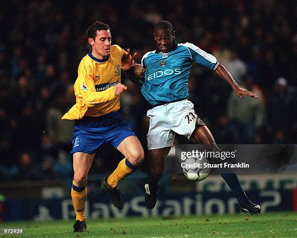 David Weir of Everton tackles Paulo Wanchope of Man City during the FA Carling Premiership match between Manchester City and Everton at Maine Road,...