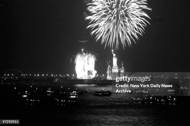 More Than 21-Gun Salute, Fireworks flare from the base of the Statue of Liberty, as sky rockets burst into a shower of pyrotechnics overhead. New...