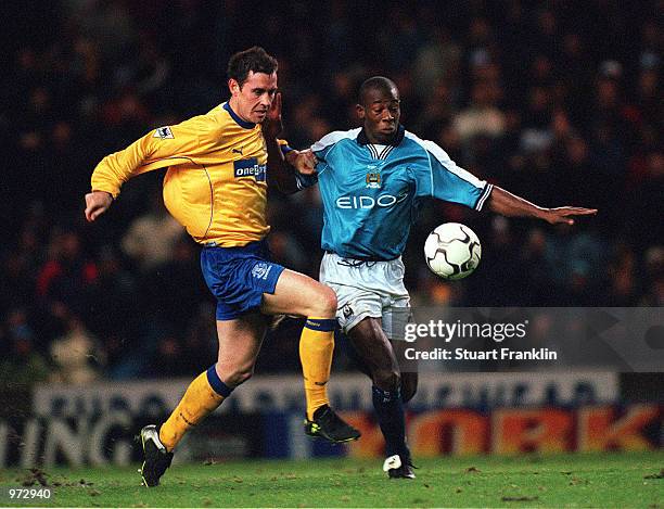 David Weir of Everton tackles Paulo Wanchope of Man City during the FA Carling Premiership match between Manchester City and Everton at Maine Road,...