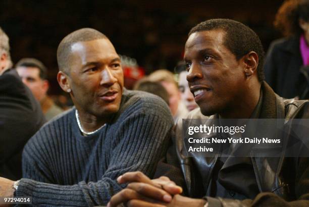 New York Yankees' Gary Sheffield and uncle Dwight Gooden take in the action at Madison Square Garden as the New York Knicks take on the Cleveland...