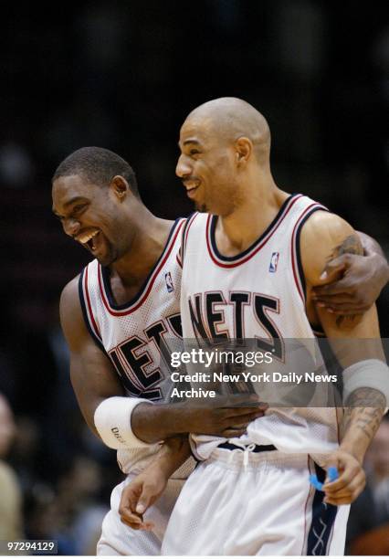 New Jersey Nets' Rodney Rogers hugs teammate Kenyon Martin after Rogers picked off an inbound pass with 8.1 seconds left in the game, setting up...