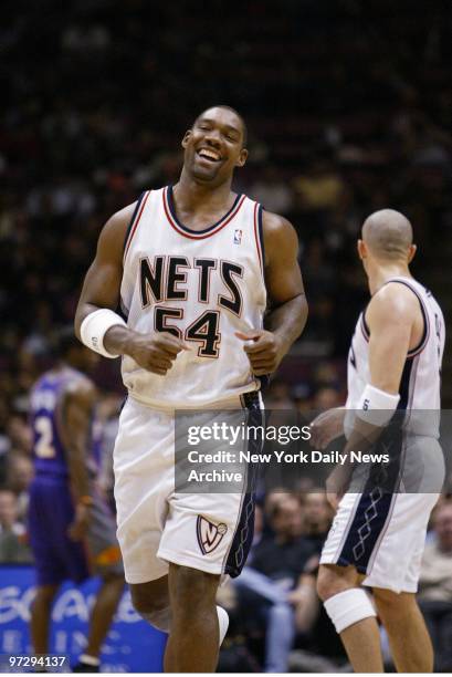 New Jersey Nets' Rodney Rogers beams after scoring a basket against the Phoenix Suns at Continental Airlines Arena. Rodgers put 18 points on the...