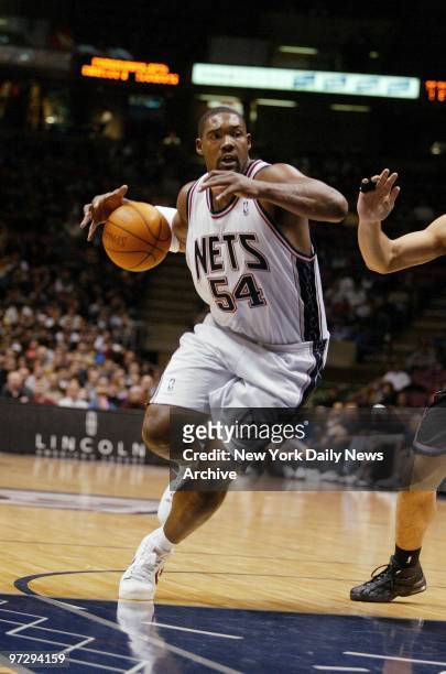 New Jersey Nets' Rodney Rogers drives to the basket during a game against the Cleveland Cavaliers at Continental Airlines Arena. The Nets went on to...