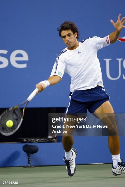 Mariano Zabaleta of Argentina hits a return to James Blake of the U.S. In first-round play at the U.S. Open at Flushing Meadows-Corona Park. Blake...
