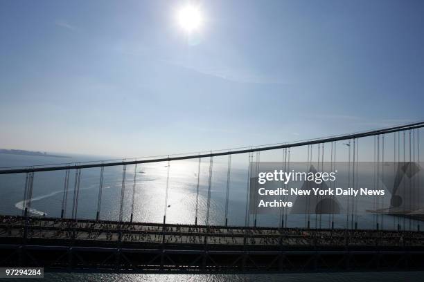 The start of the New York City Marathon. Runners going across the Verrazano Narrows Bridge, shot from a helicopter.,