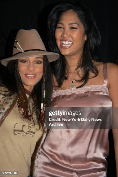 Singer Alicia Keys and Baby Phat designer Kimora Lee get together backstage during a showing of Baby Phat's Fall 2003 line at the Tent in Bryant Park...