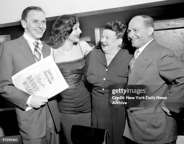 Frank Sinatra and wife Ava Gardner with his parents at opening of Sinatra's new movie "Meet Danny Wilson"