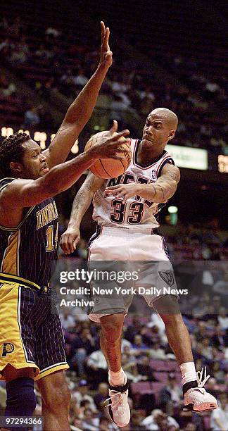 New Jersey Nets' Stephon Marbury is blocked by Indiana Pacers' Sam Perkins during game at Continental Air Arena.