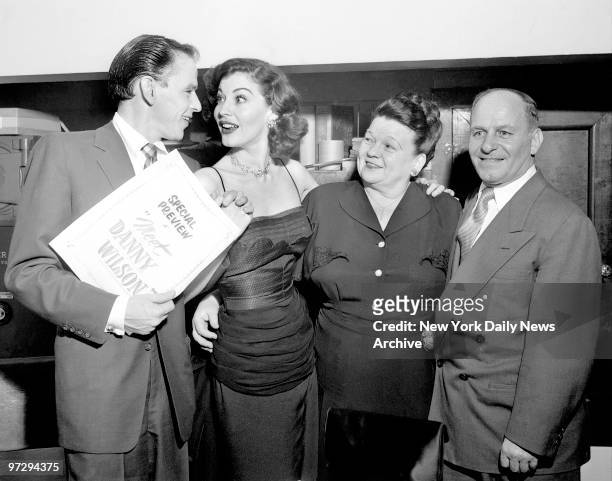 Frank Sinatra and wife Ava Gardner with his parents at opening of Sinatra's new movie "Meet Danny Wilson"