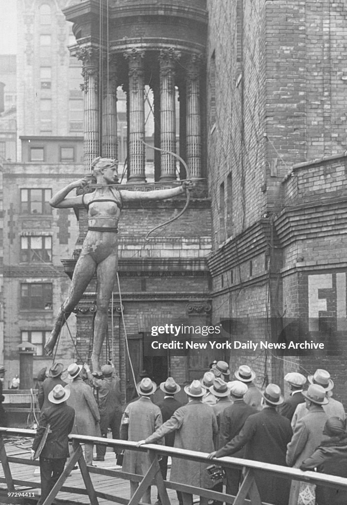The statue of Diana is removed after being on top of the old